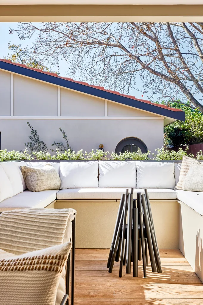 Californian bungalow renovation with fire pit, built-in seating and outdoor cushions